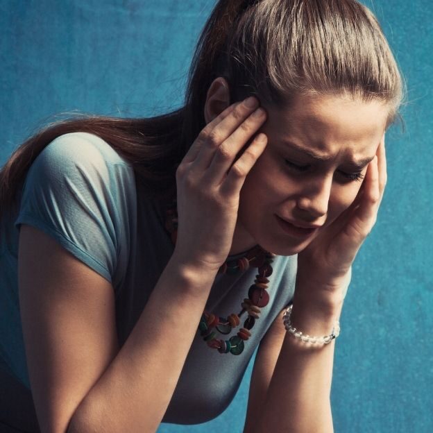 A woman crying at work.
